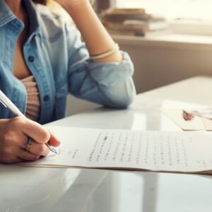 caucasian-woman-writing-letter