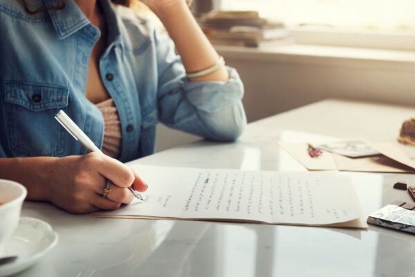 caucasian-woman-writing-letter