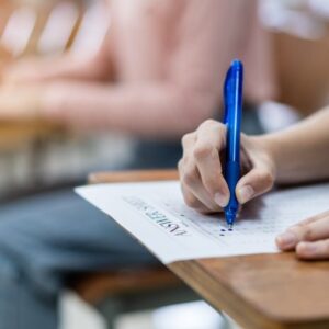 close-up-young-female-university-students-concentrate-doing-examination-classroom-girl-student-writes-answer-examinations-answer-sheet-classroom