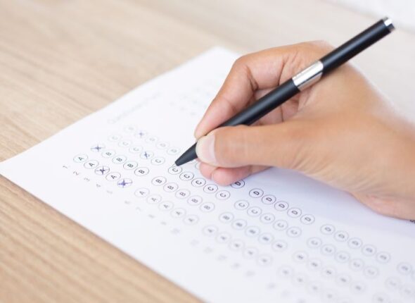 closeup-person-filling-out-questionary-form