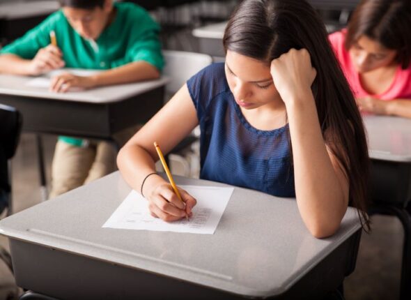 group-high-school-students-taking-test-classroom
