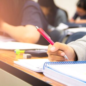 hands-university-student-study-quiz-test-exam-from-teacher-large-lecture-classroom-school
