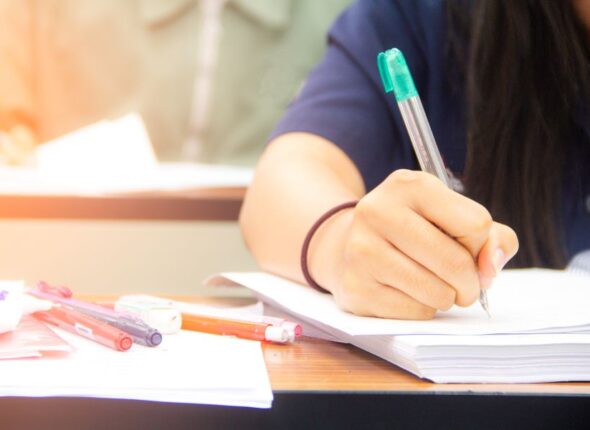hands-university-student-study-quiz-test-exam-from-teacher-large-lecture-classroom-school