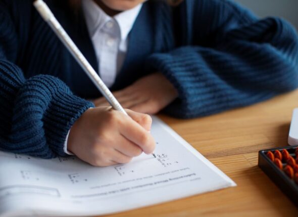 high-angle-girl-learning-math-school