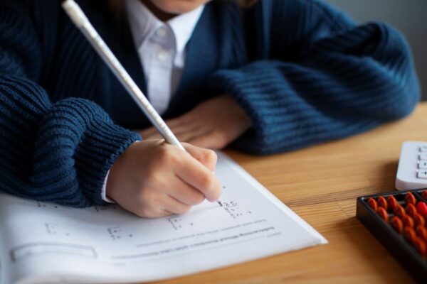 high-angle-girl-learning-math-school